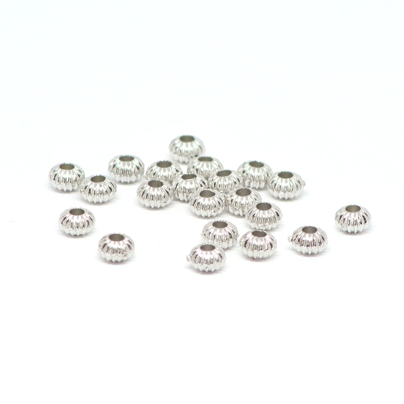 Perlen silberne gemusterte Kugeln 0,4 x 0,3 cm, 50 oder 100 Stck