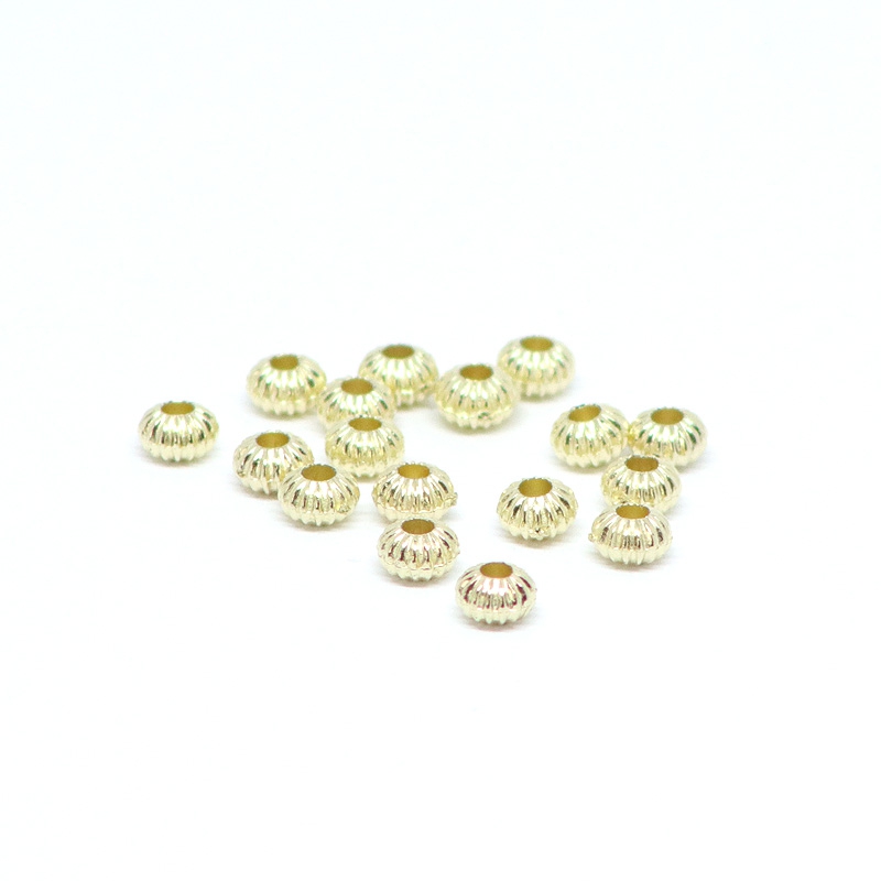 Beads golden patterned balls 0,4 x 0,3 cm, 50 pieces